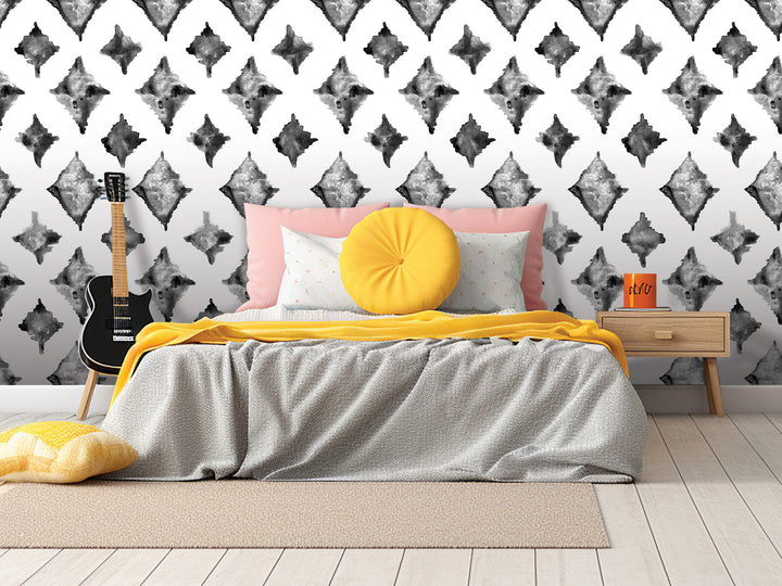 a modern bedroom with a bed, yellow throw pillow, and a guitar on a stand. The wall behind the bed has a black and white diamond pattern.