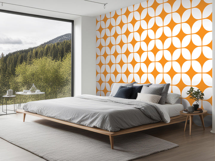 a modern bedroom with a large bed, a wooden nightstand, and a large window overlooking a forested area.