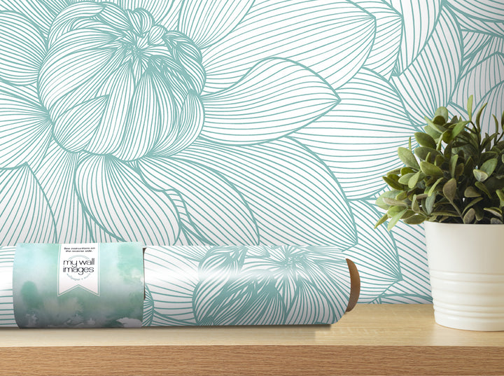 a wallpapered wall with a large, intricate floral pattern, and a potted plant placed on a shelf next to it.