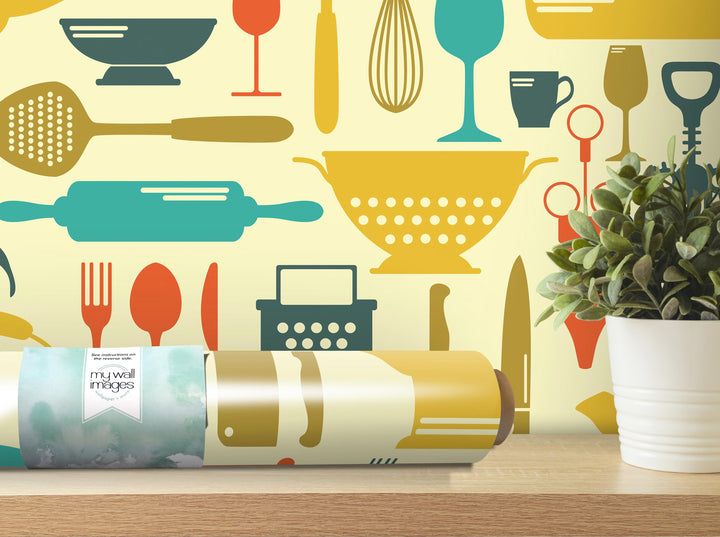 a wall with a repeating pattern of various kitchen utensils and appliances, including a rolling pin, wine glass, whisk, and other items, all rendered in a vibrant and colorful style.