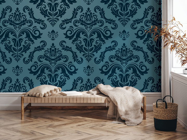 a modern living room with a blue and white damask wallpaper, a wooden bench with a white pillow, and a woven basket on the floor.