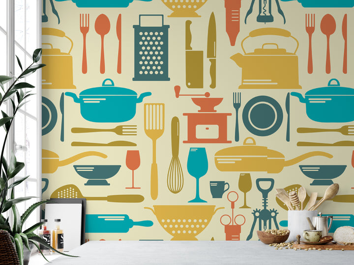 a wallpapered wall with various kitchen utensils and appliances depicted in a repeating pattern, including pots, pans, knives, spoons, and other cooking tools.