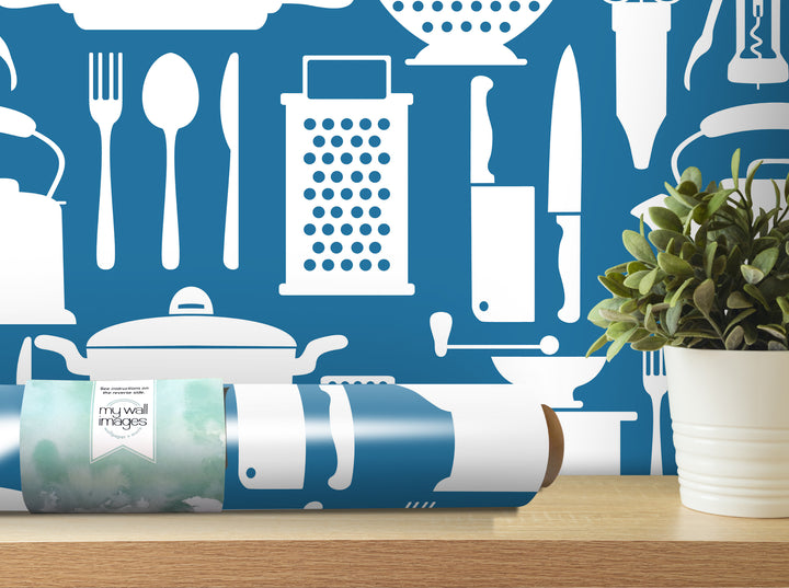 a kitchen-themed wallpaper with various kitchen utensils and appliances, such as a knife, a grater, a pot, and a plant, all depicted in white against a blue background.