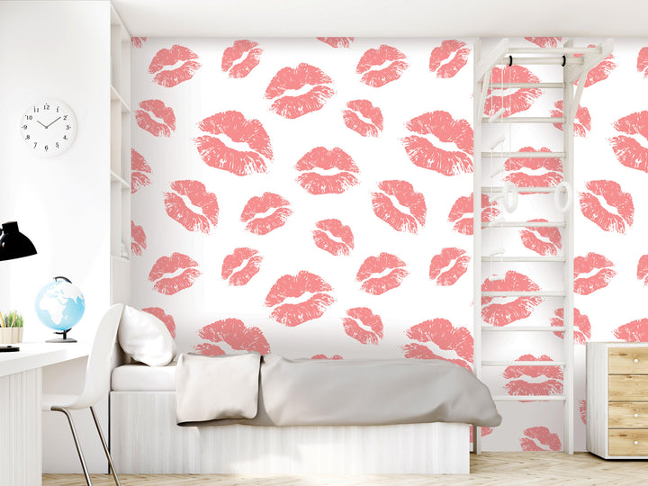 a bedroom with a white bed, a wall with a pink lips wallpaper, a dresser, a clock, and a ladder.