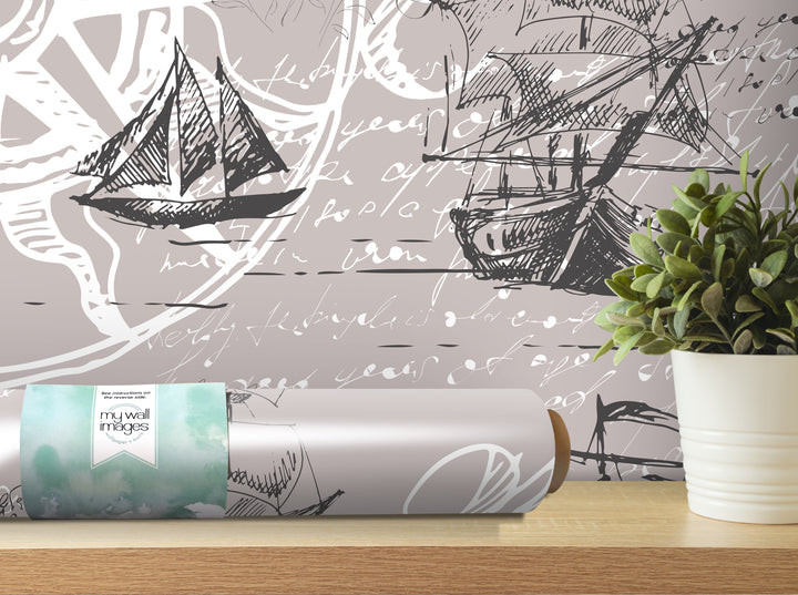 a wall with a large, abstract drawing of a sailboat and a plant in a white pot, along with a roll of wallpaper that has a watercolor-like design.