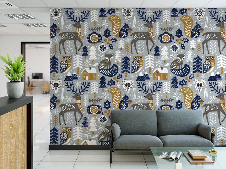 a modern office space with a large wall mural depicting a winter forest scene with various animals and elements such as trees, snowflakes, and a cabin. The office has a gray sofa and a glass coffee table in the foreground, and a potted plant is visible on the left side of the image.