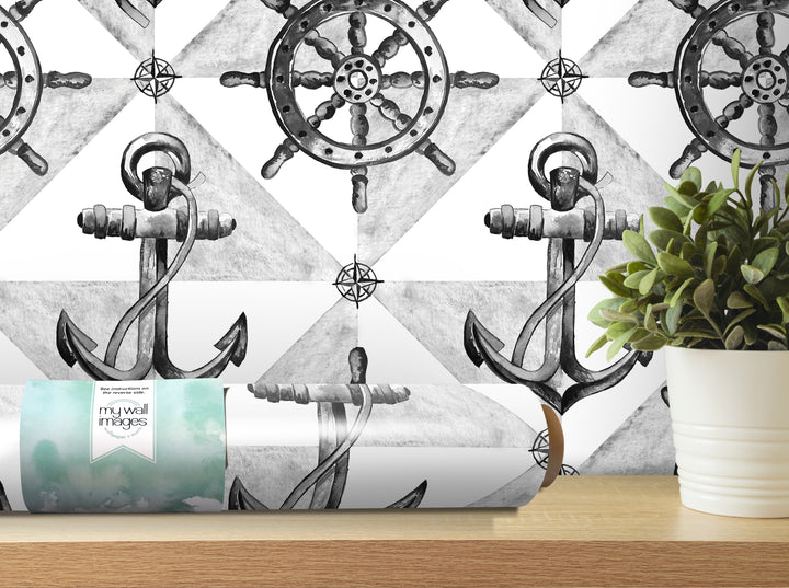 a black and white wallpaper with a repeating pattern of anchors and a ship's wheel, as well as a potted plant on a shelf.