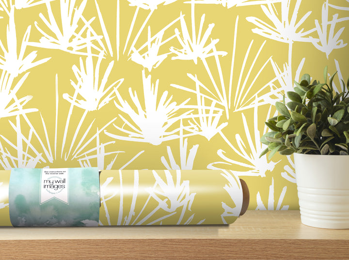 a yellow and white patterned wallpaper with a potted plant on a shelf next to it.