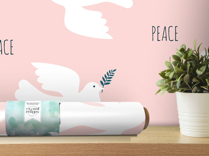 a white dove holding a peace sign, with the word "PEACE" written in the background. There is also a potted plant and a roll of wallpaper on a shelf.