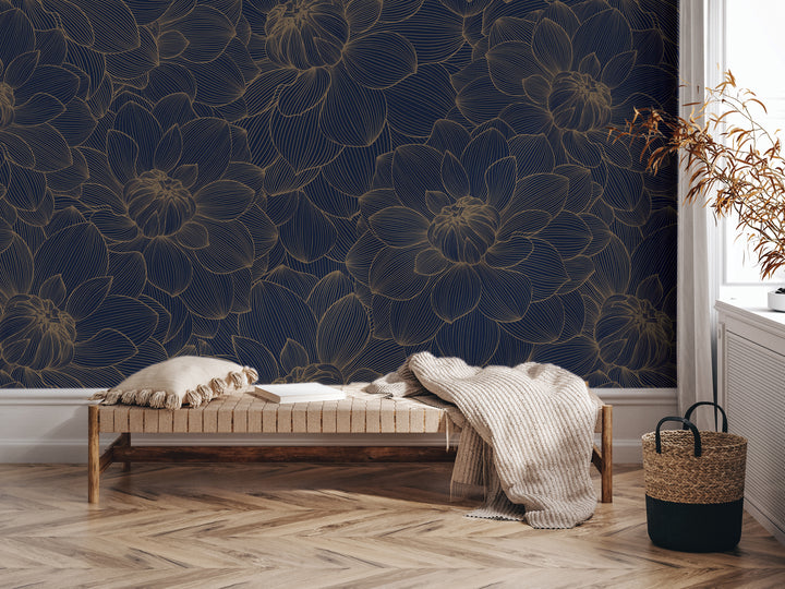 a living room with a dark blue floral wallpaper on the wall behind a wooden bench. The bench is positioned in front of a window, and there is a woven basket on the floor next to it.