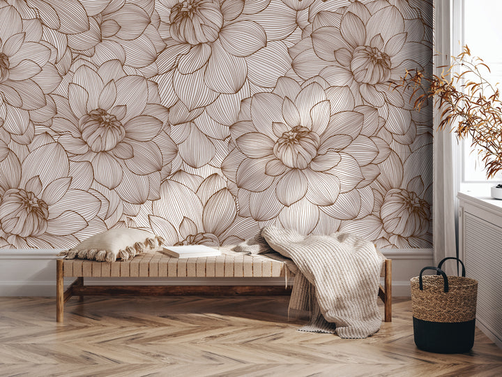 a living room with a floral wallpaper pattern on the wall behind a wooden bench. The bench is positioned on a hardwood floor, and there is a woven basket nearby.