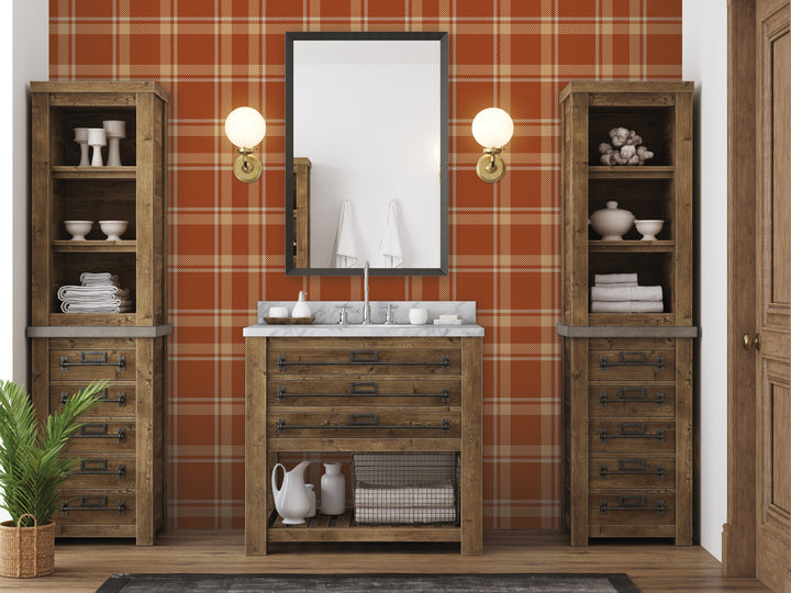 a bathroom with a wooden vanity, a mirror, and two wooden cabinets. The walls are covered in a checkered orange and white pattern, and there are two light fixtures above the vanity.