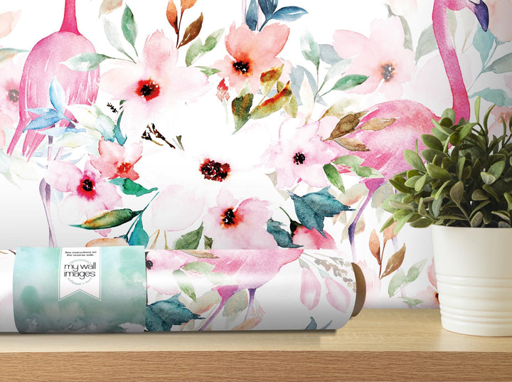 a vase of flowers next to a wall mural