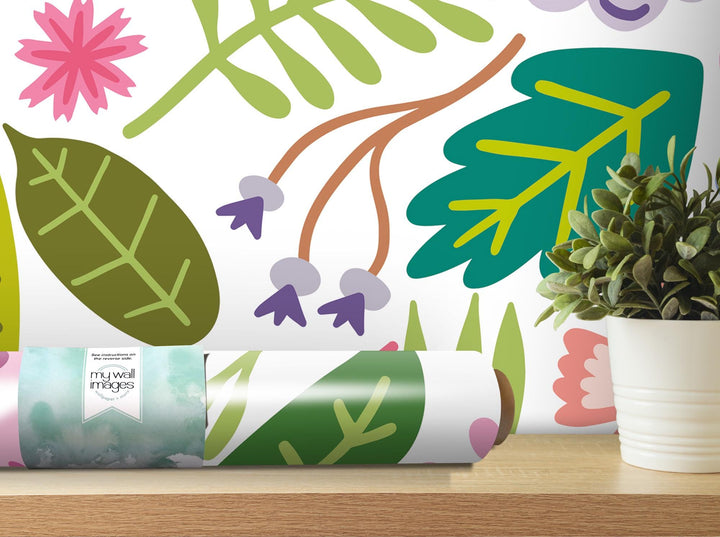 a potted plant sitting on a table next to a wallpaper