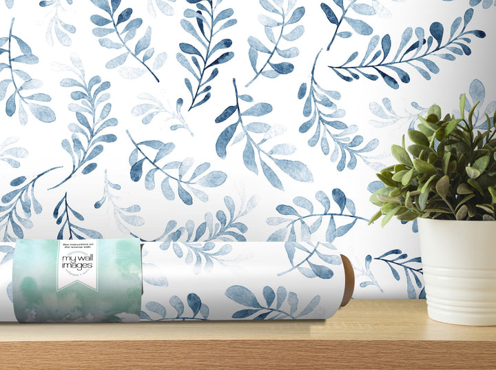 a plant is sitting on a shelf next to a book