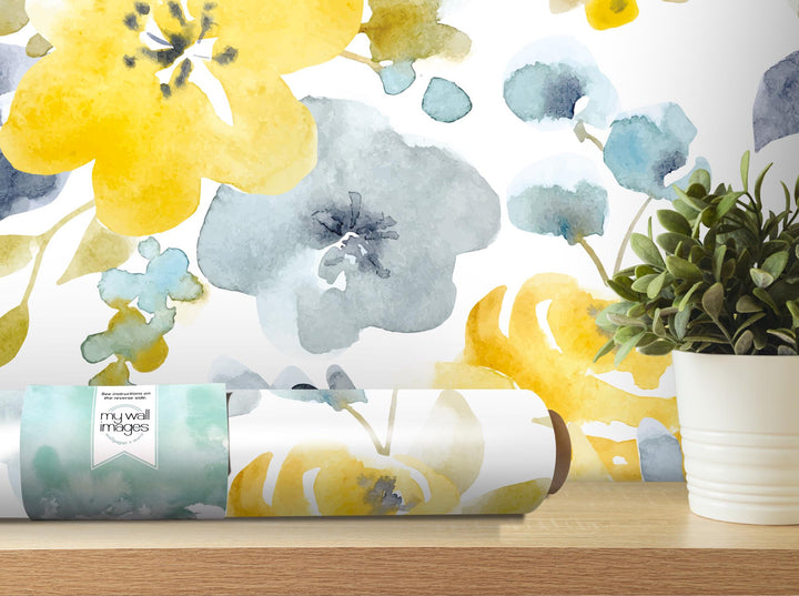 a painting of flowers on a wall next to a potted plant