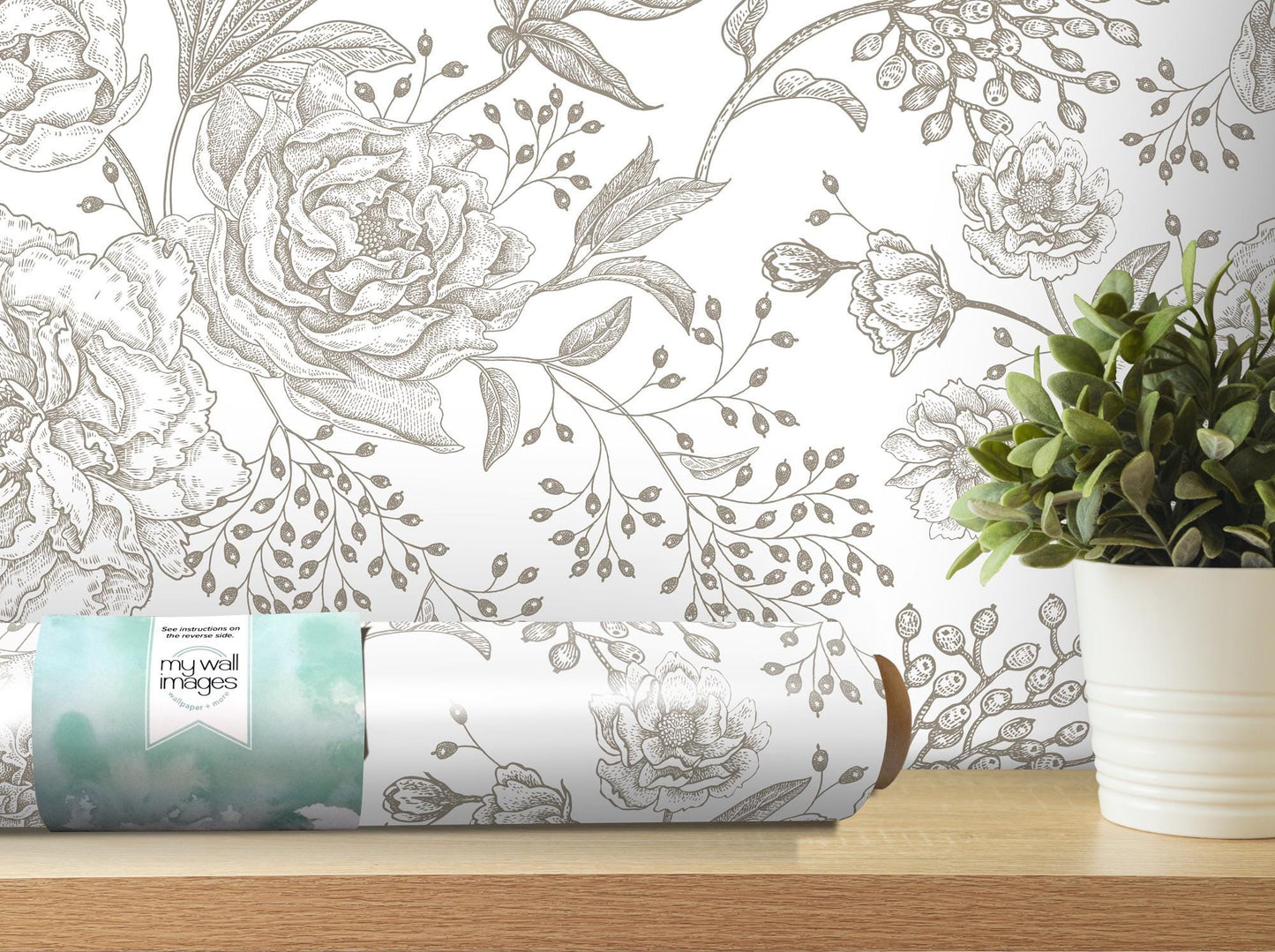 a vase of flowers and a rolled up paper on a table