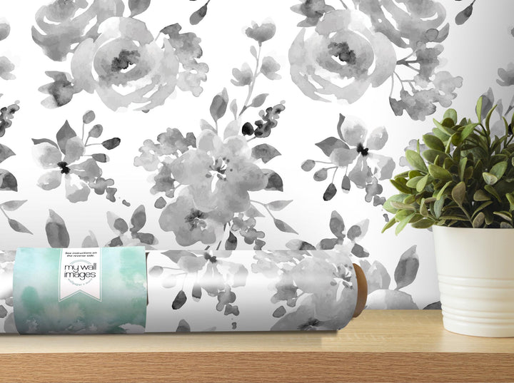 a vase with a plant on a shelf next to a wallpaper