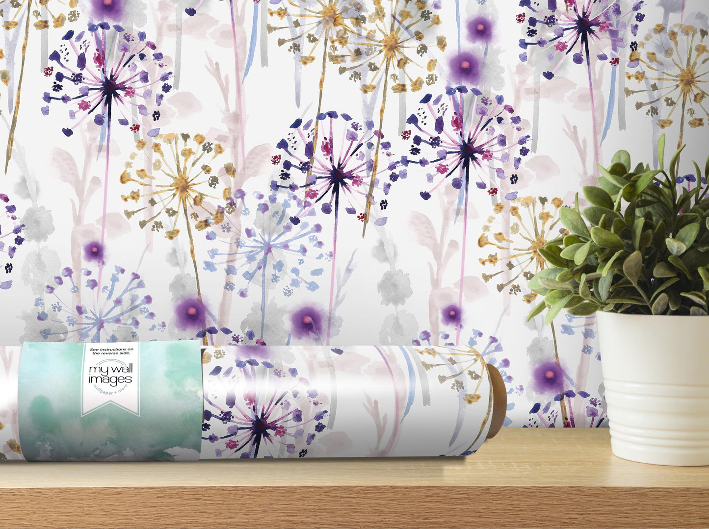 a vase with a plant next to a wall paper
