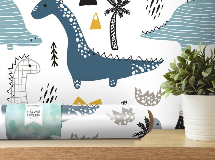 a plant is sitting on a table in front of a wall mural