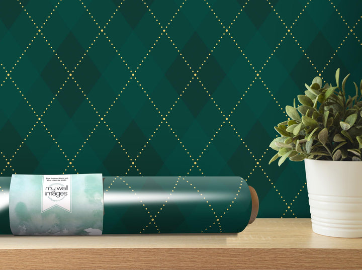 a plant in a white vase next to a green wallpaper