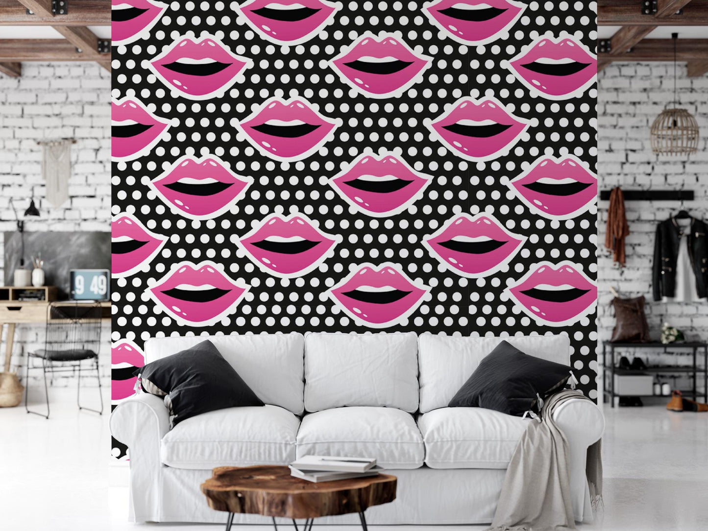 a white couch sitting under a pink and black wall