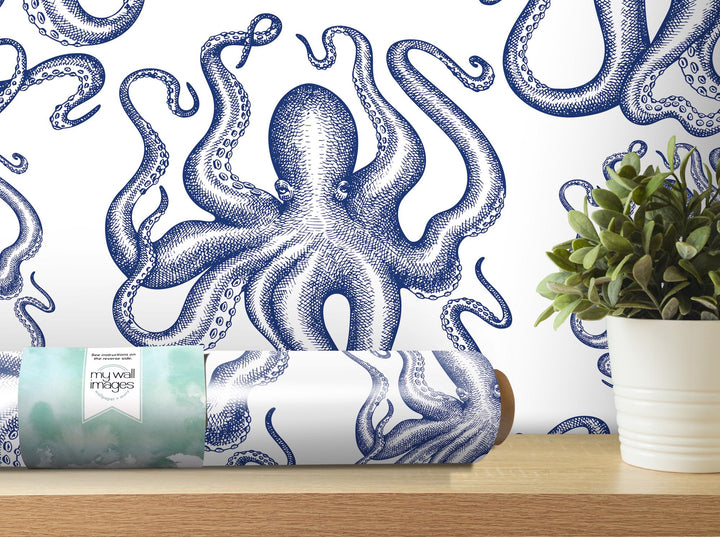 a blue and white octopus wallpaper next to a potted plant
