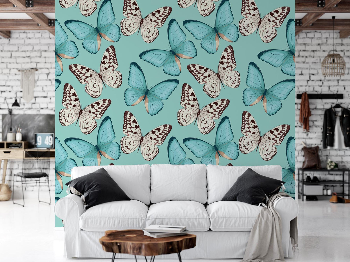 a living room with a white couch and a blue butterfly wallpaper