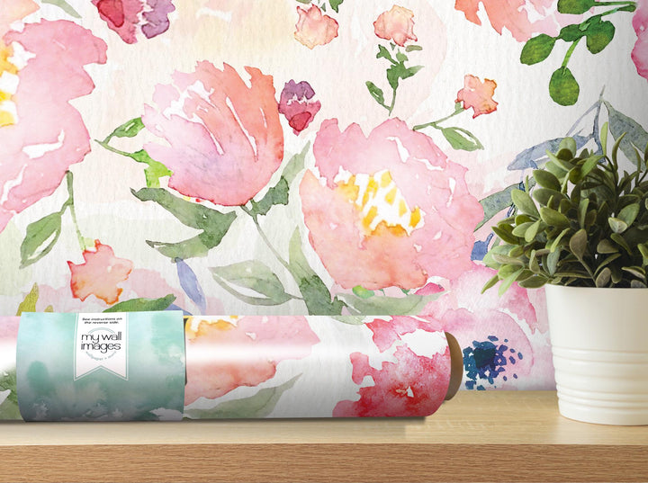 a vase with a plant on a table next to a wallpaper