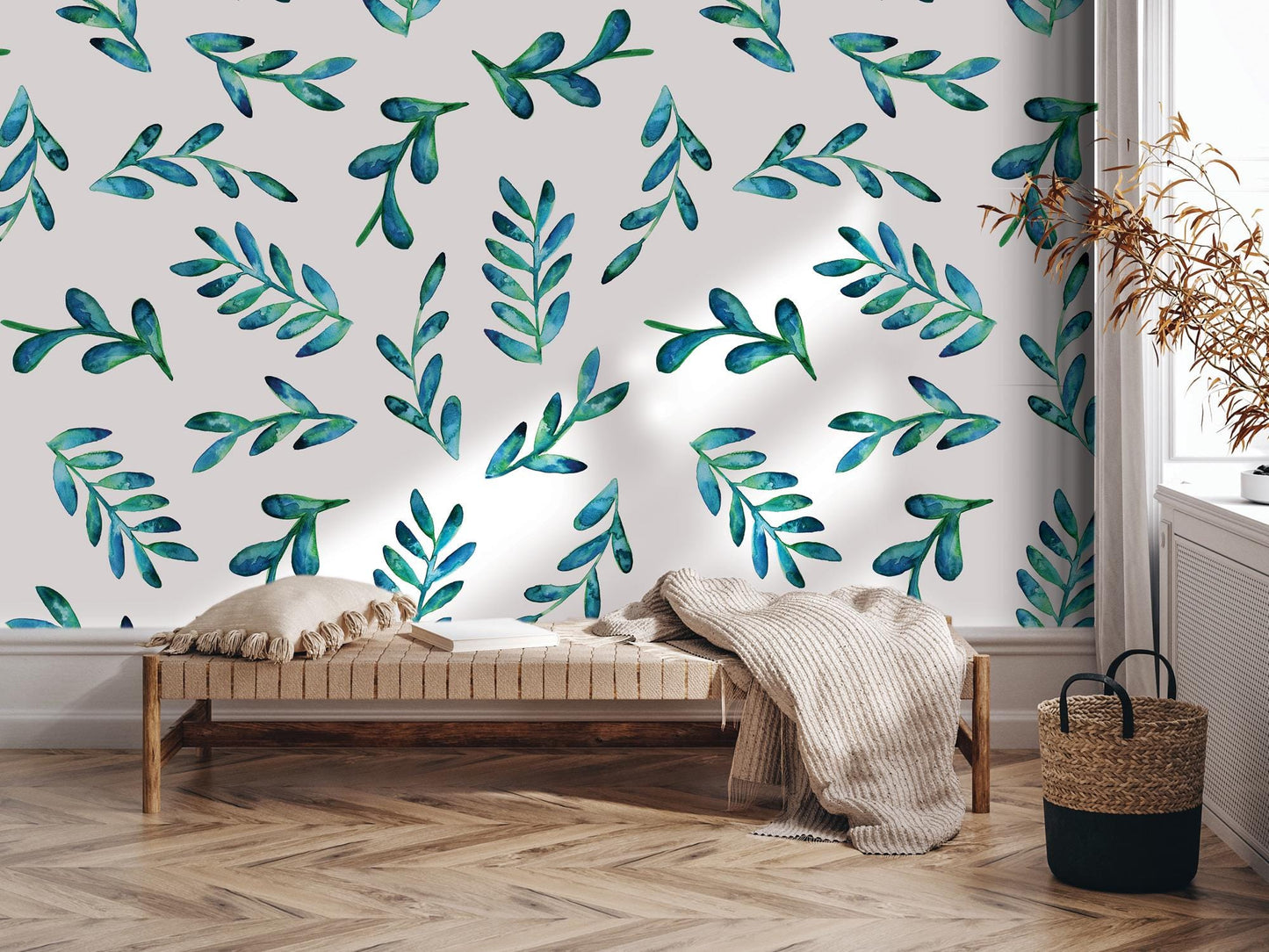 a room with a bed and a wall with a painting of leaves on it