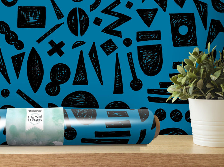 a blue wall with black and white designs on it