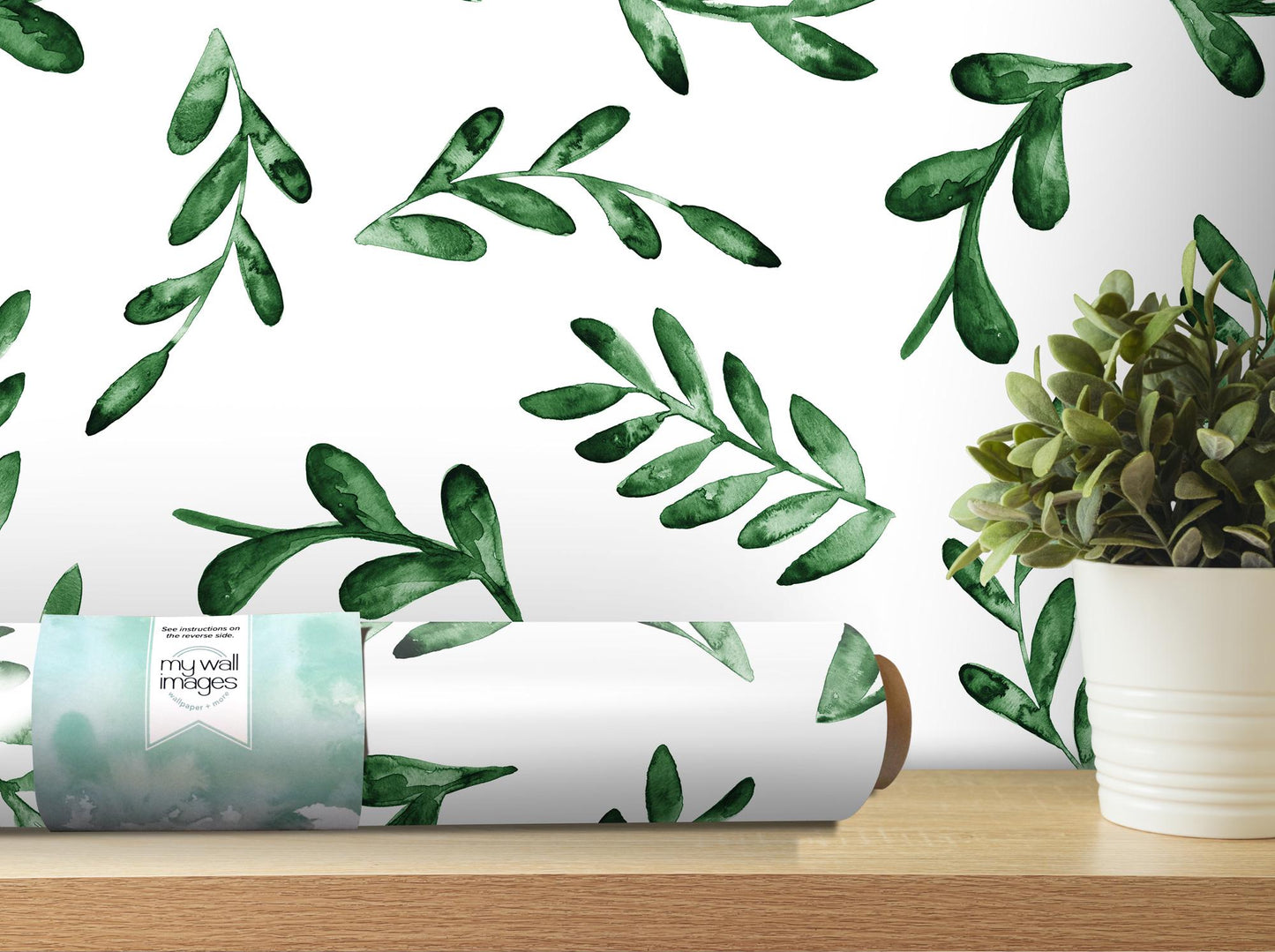 a plant and a roll of paper on a table