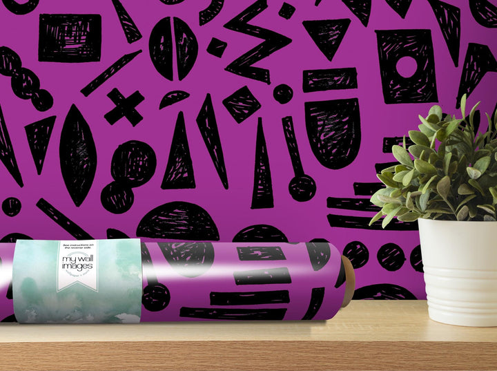 a purple wall with black and white designs on it
