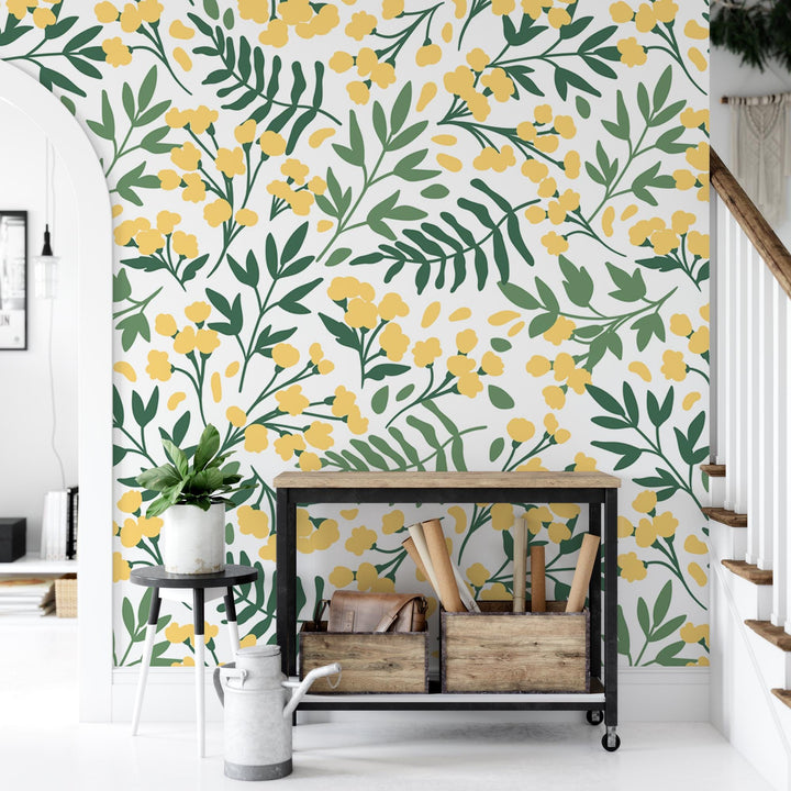 a yellow and green floral wallpaper in a living room