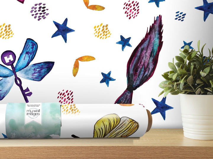 a vase with a plant next to a wall mural