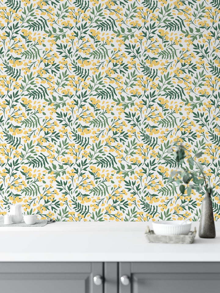 a white table with a vase of flowers on top of it