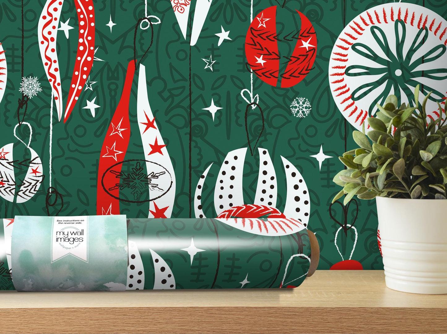 a green christmas wrapping with red and white ornaments