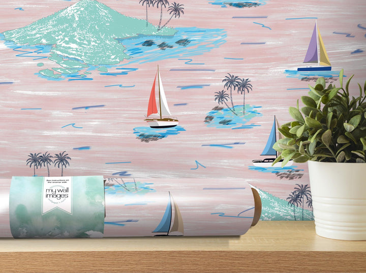 a table with a potted plant and a wallpaper with sailboats