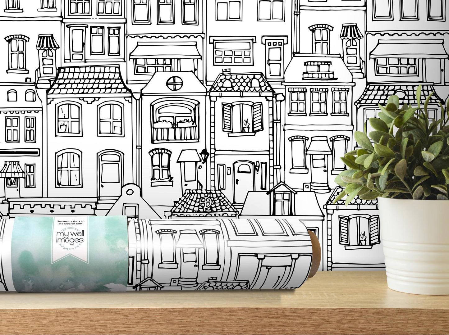 a can of paint next to a potted plant