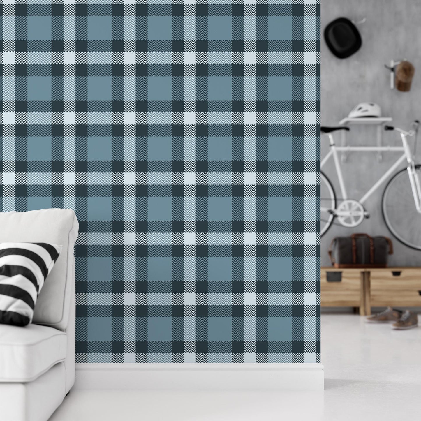 a living room with a white couch and a blue plaid wall