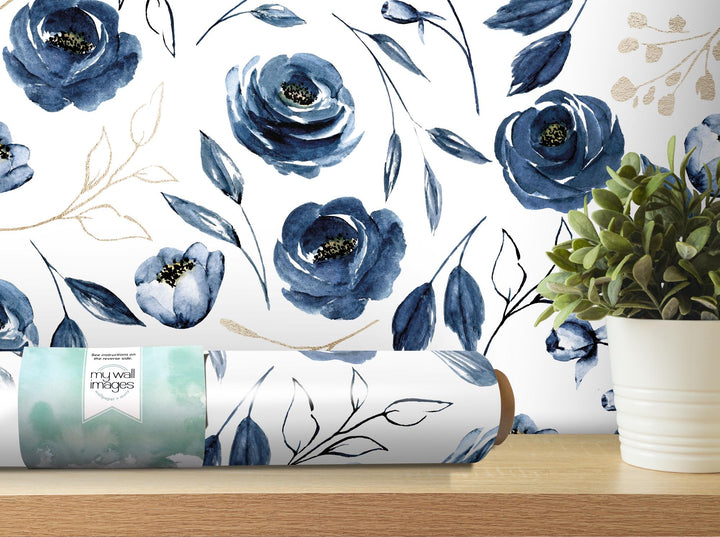 a vase with a plant on a table next to a wallpaper