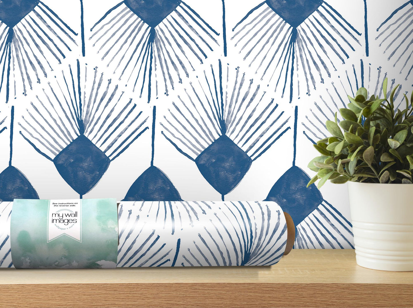 a vase with a plant on a table next to a wallpaper