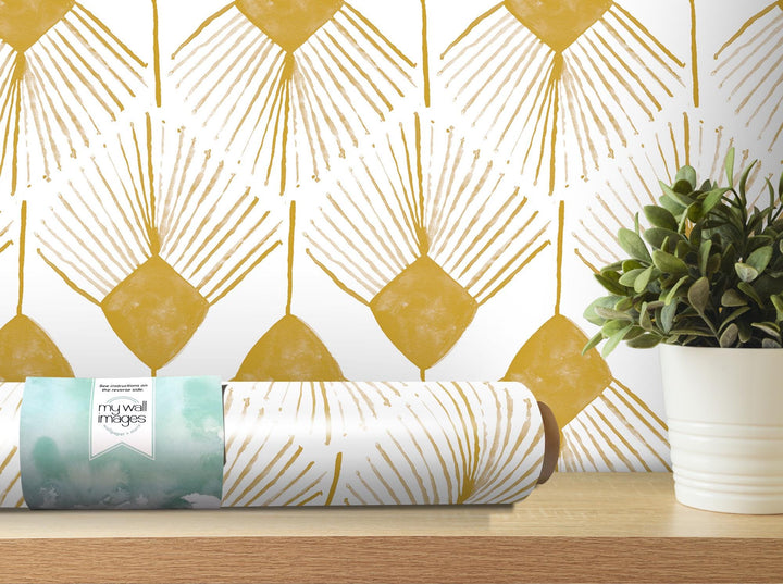 a wrapped present sitting on a table next to a potted plant