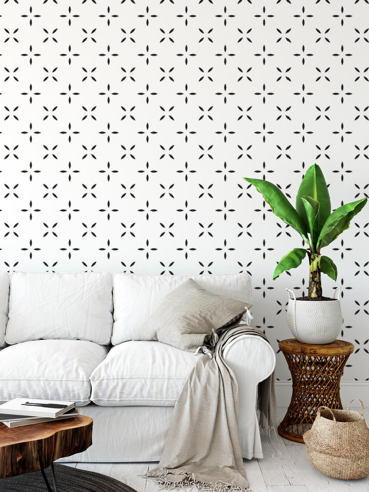 a living room with a white couch and a potted plant