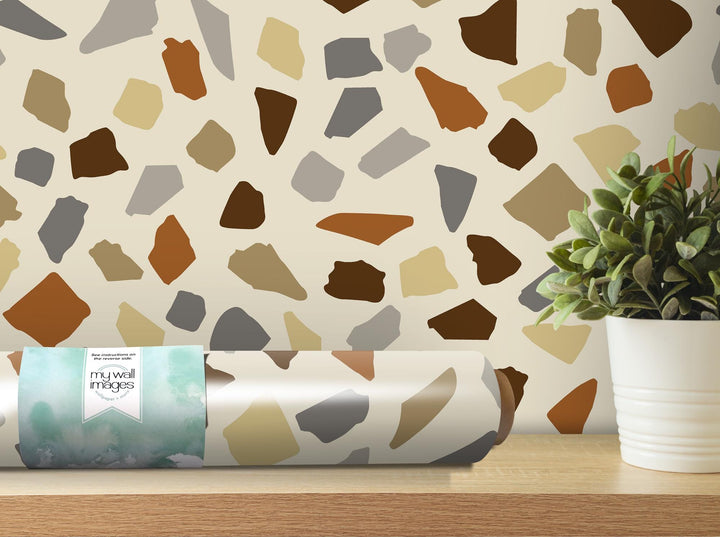 a vase with a potted plant on a table