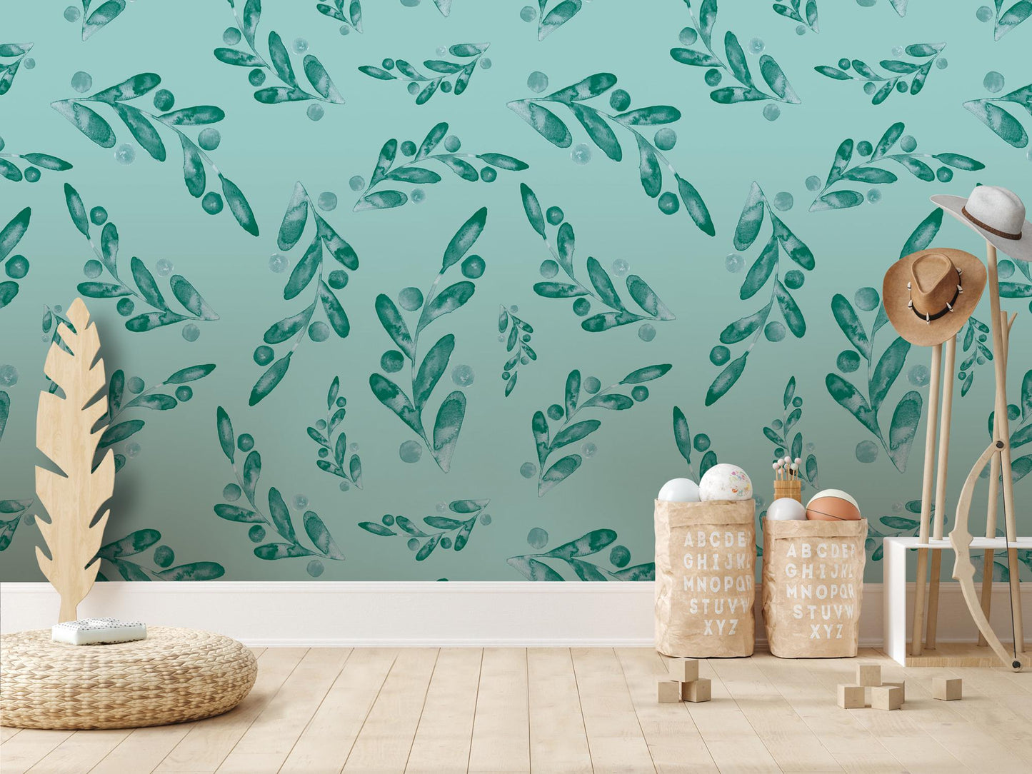 a room with a blue wall and green leaves on the wall