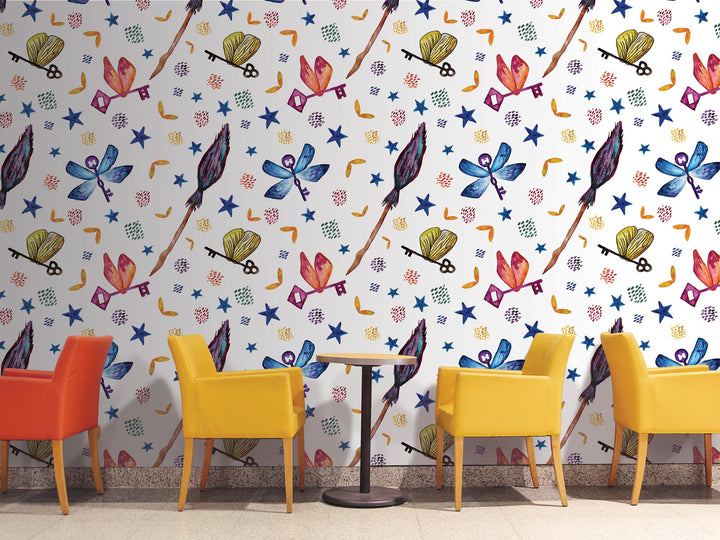 a room with a wall with a pattern of colorful chairs and a table