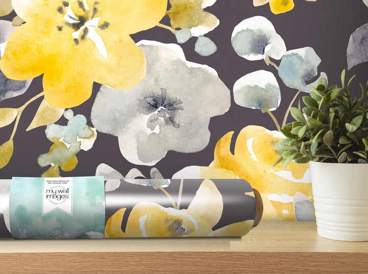 a vase with a plant next to it on a table