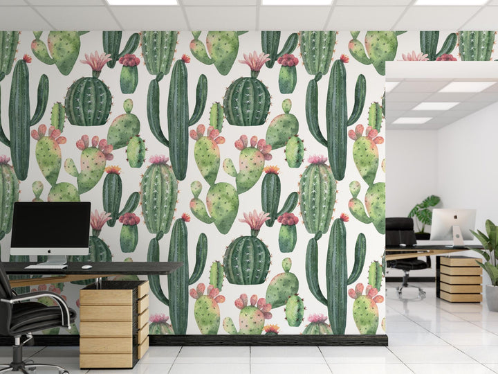 an office with a cactus wallpaper and desks