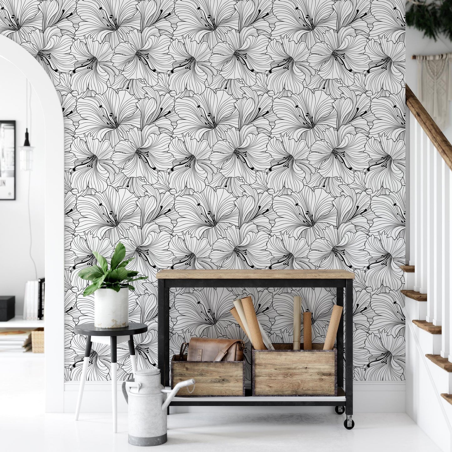 a white and black floral wallpaper in a living room